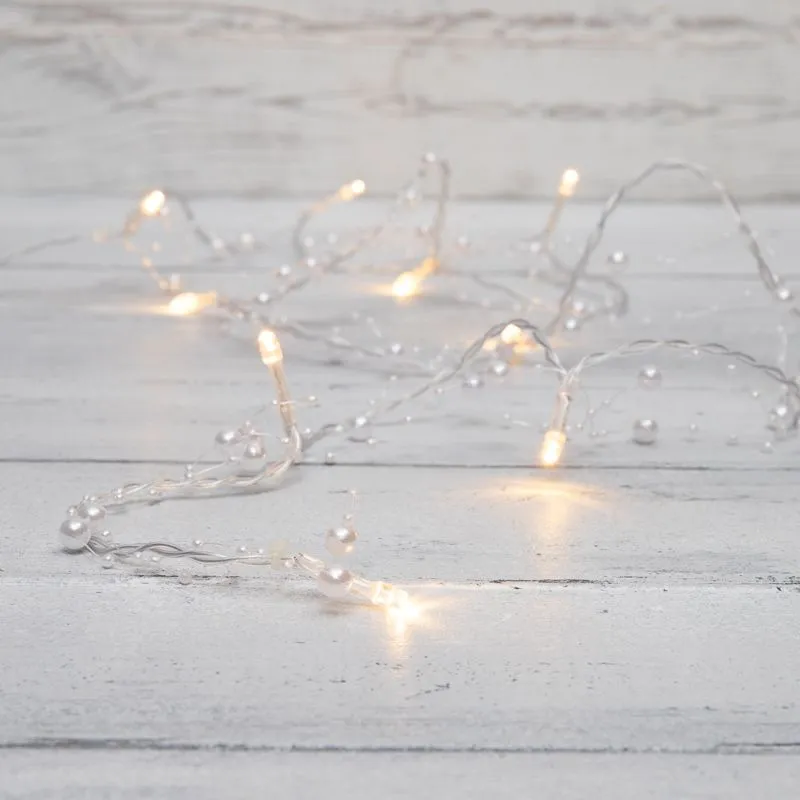 Гирлянда светодиодная Жемчужинки 1,5 м, 10 LED, прозрачный ПВХ, цвет свечения теплый белый, 2 х АА (батарейки не в комплекте) NEON-NIGHT 303-097
